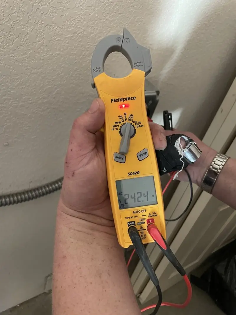 Voltage testing with clamp meter during Electrical Installation Services in Eagle